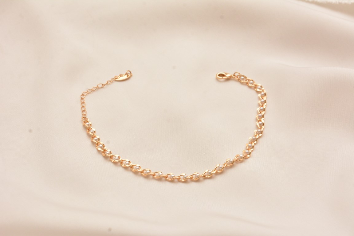 golden white beaded anklet with charm